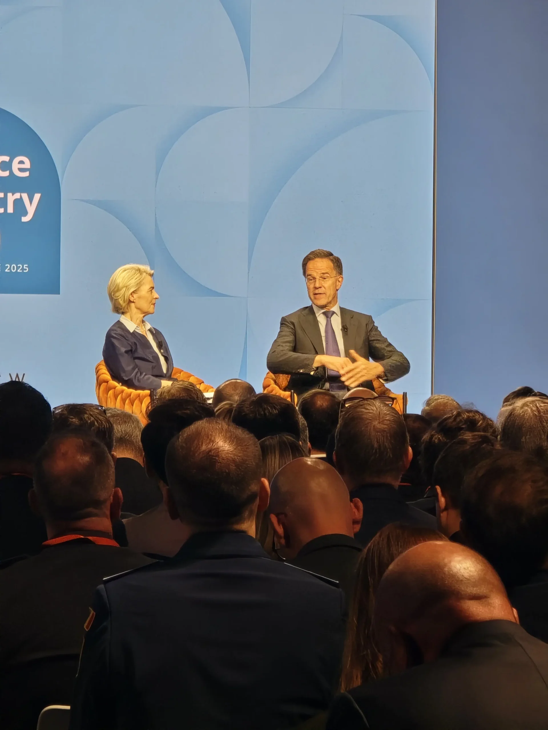 Mark Rutte and Ursula von der Leyen on stage at NATO Summit Defence Industry Forum The Hague 2025
